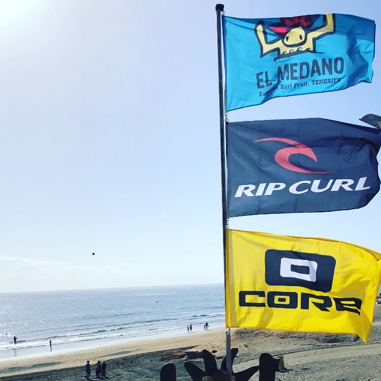 Surfshop on the beach with flags